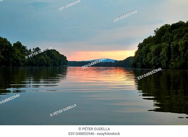 River landscape from a canoe with twilight sky