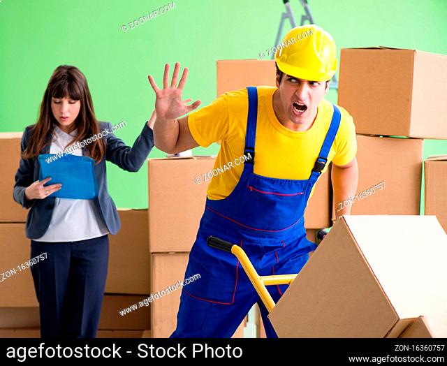 The woman boss and man contractor working with boxes delivery