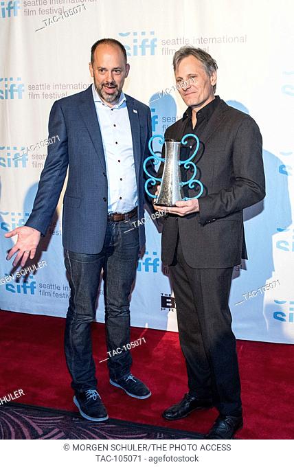 (L) Festival Director and Chief Curator Carl Spence with Actor Viggo Mortensen as he holds the Award for Outstanding Achievement in Acting given him by the...