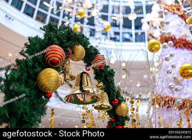 Christmas jingle bell hanging with christmas grass deco at mall