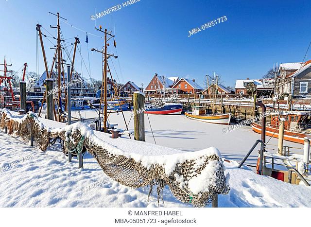 Winter atmosphere, shrimp boat in the harbour of Neuharlingersiel, Eastern Frisia, Lower Saxony, Germany