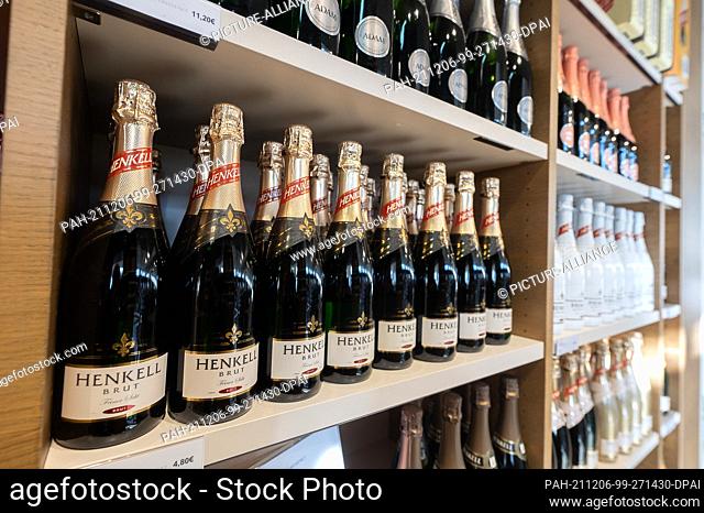 09 November 2021, Hessen, Wiesbaden: Bottles of Henkell sparkling wine stand in the sales room at the Henkell & Co. sparkling wine cellar