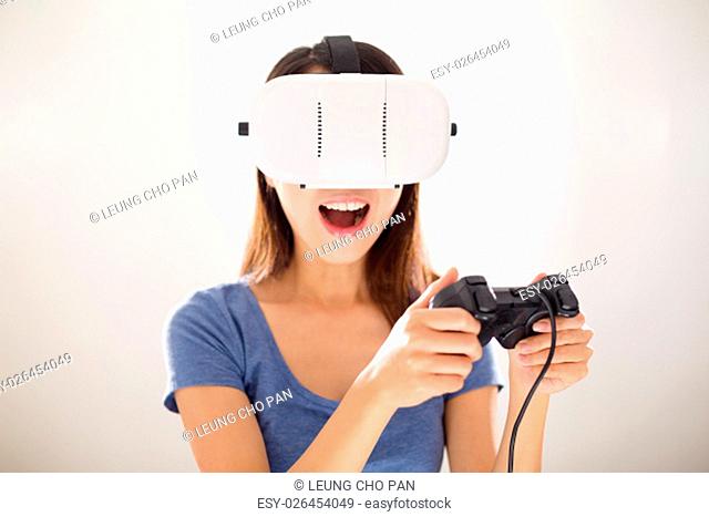 Woman play game with VR device