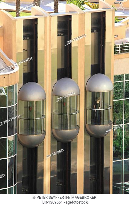 Three glass elevators on the facade of the Hotel Le Méridien Beach Plaza, Le Larvotto, Monaco, Cote d'Azur, Europe