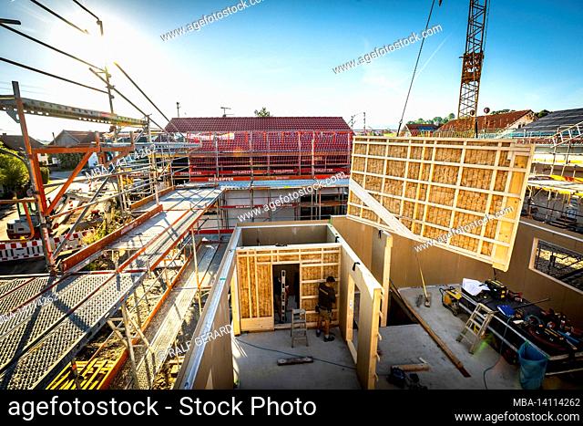 germany, bavaria, construction of a prefabricated wooden house, installation of a partition wall