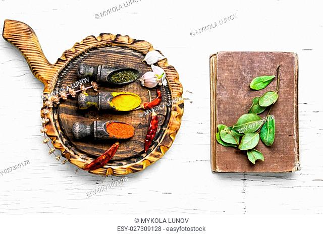 large mix of spicy spices in spoons on white background