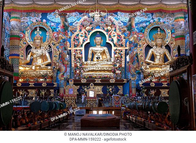 Statues of Padmasambhav Budhushtrayamnni and Amitay in biggest Namdroling monastery at Kushal nagar ; District Coorg ; Karnataka ; India