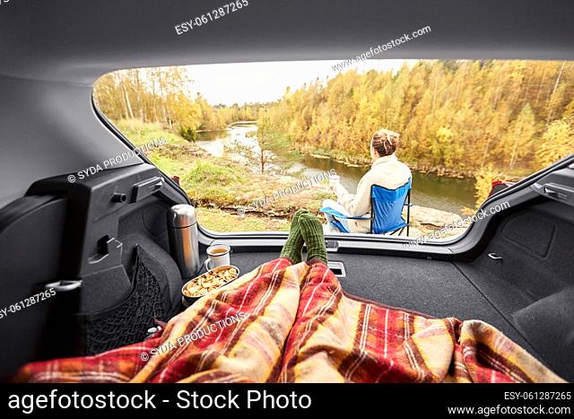 view to river from car with feet under blanket