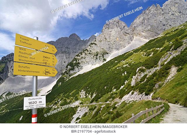 Signpost on the hiking path connecting Gruttenhuette mountain lodge and Ellmauer Halt, Wilder Kaiser mountain, Tyrol, Austria, Europe