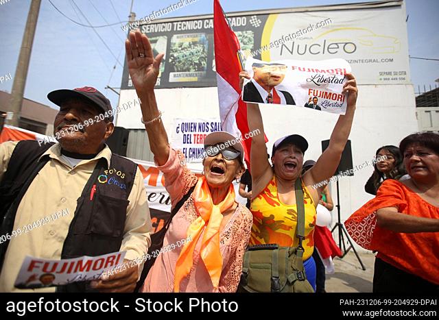 06 December 2023, Peru, Lima: Supporters wait outside the prison for the release of former Peruvian President Fujimori. The ex-president is serving a 25-year...