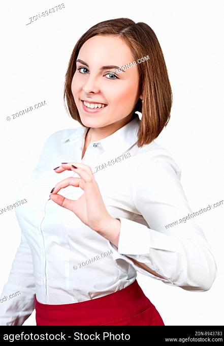 Young beautiful woman shows OK sign isolated on white background