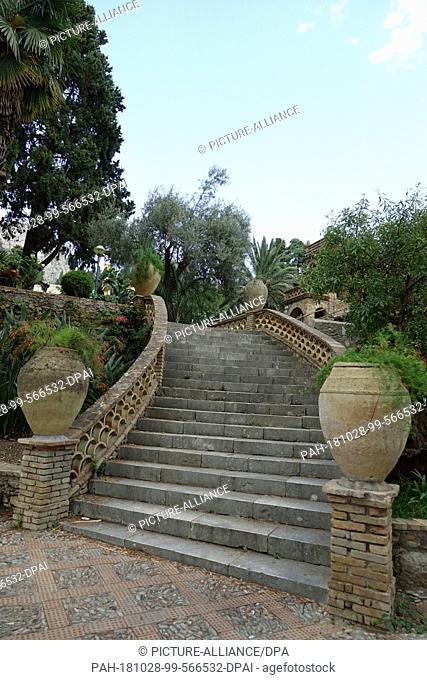 03 September 2018, Italy, Taormina: Amphorae standing on a large staircase in the Giardino Pubblico in Taormina. The approximately three-hectare site belonged...