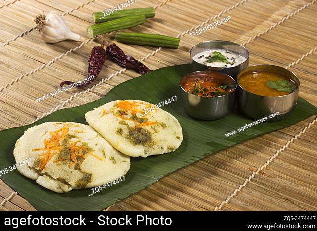 Idli with both sambar and coconut chutney. South Indian breakfast or snack dish