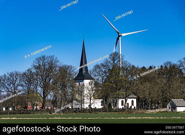 Grinstad, Sweden The Grinstad church and wind turbine in a thicketof trees