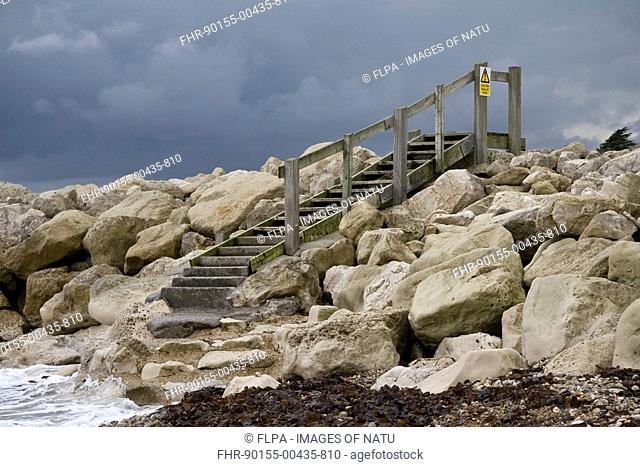 Steps over coast protection breakwater, Ringstead Bay, Dorset, England, november
