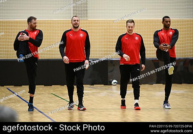 15 January 2022, Slovakia, Bratislava: Goalkeeper Andreas Wolff (l-r), Julius Kühn, Luca Witzke and Djibril M'Bengue take part in the training of the German...