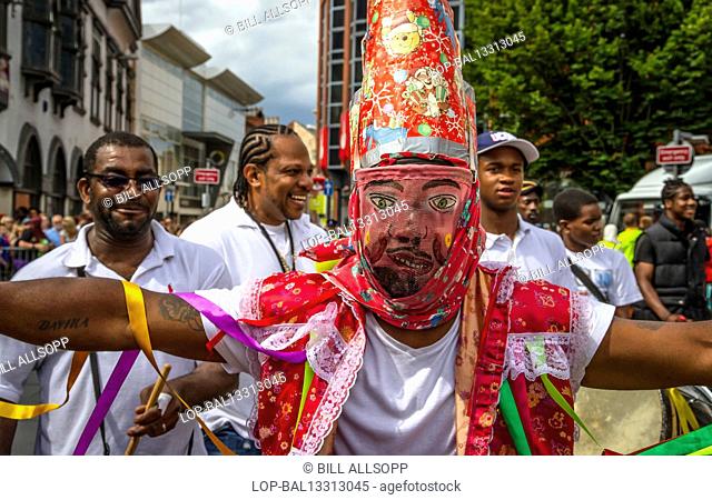 England, Leicestershire, Leicester. Masked dancer at Leicester Caribbean Carnival