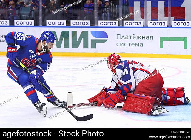 RUSSIA, ST PETERSBURG - APRIL 2, 2023: CSKA Moscow goaltender Adam Reideborn (R) defends against SKA St Petersburg’s Svyatoslav Grebenshchikov in Leg 1 of their...