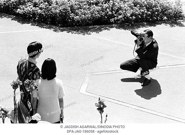 Man photographing couple Edinburgh Place Central Hong Kong Asia 1971