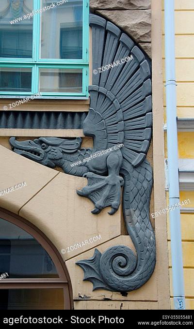 Fairy-tale dragon on the facade of an art nouveau apartment building in Old Tallinn, Pikk Street