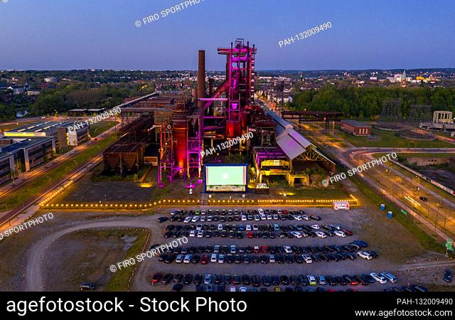 firo: 26.04.2020, Germany, NRW, Dortmund, industrial culture, Ruhr area, cinema in Corona times, drive-in cinema in Dortmund against the backdrop of a typical...