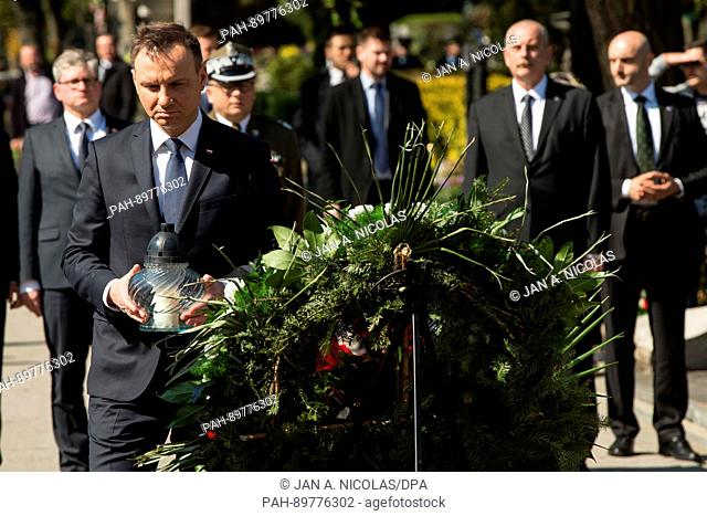 On 10.04.2017, Poland, Poland., the 7. anniversary of the Smolensk air crash Polish President Adrzej Duda places a candle curing a wreath laying ceremony at the...
