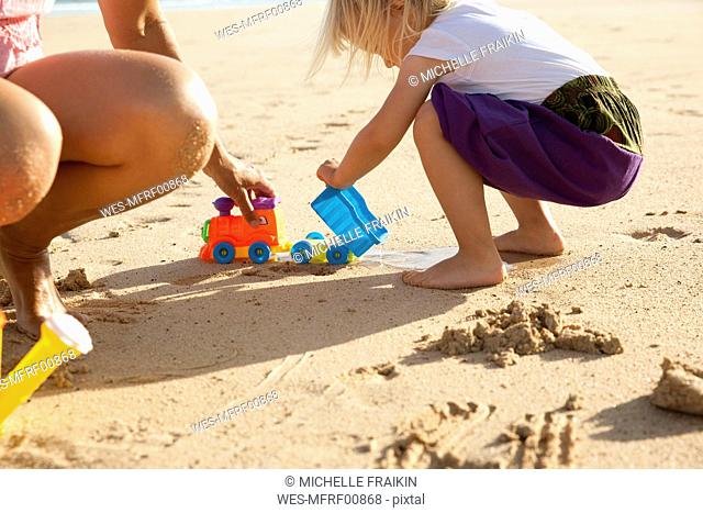 Spain, Fuerteventura, mother and daughter playing on the beach