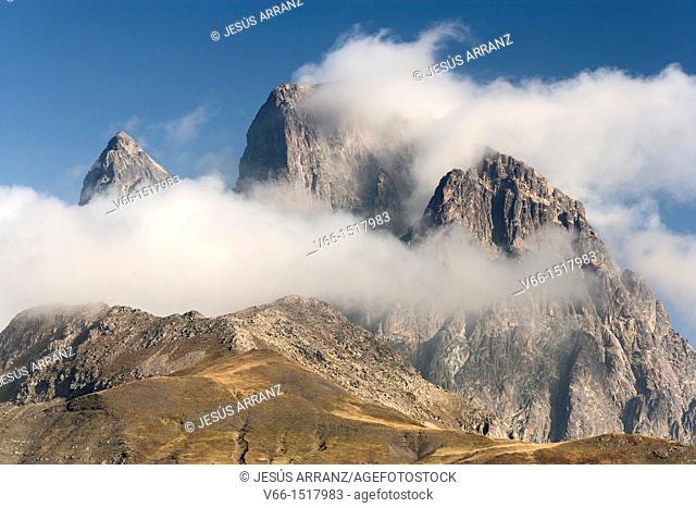 Pic du Midi d'Ossau (France) in the clouds, view from the Tena Valley in the Spanish province of Huesca