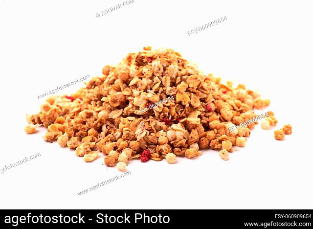 Heap of premium fruit and nut muesli isolated on white background