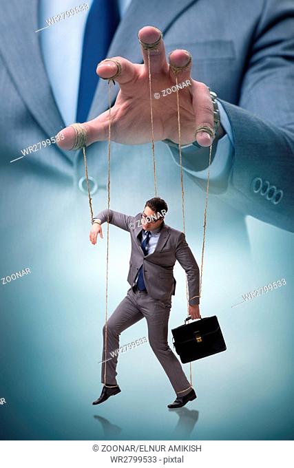 Businessman puppet being manipulated by boss