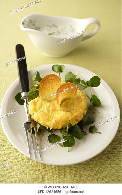 Potato cake with cheese and herbs