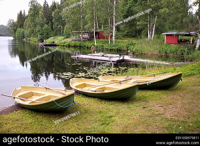 Boats on the bank of the forest lake. Finland