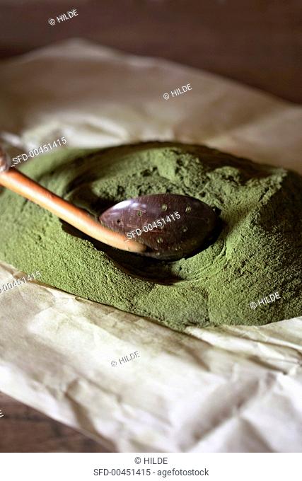 Stevia powder with a slotted spoon