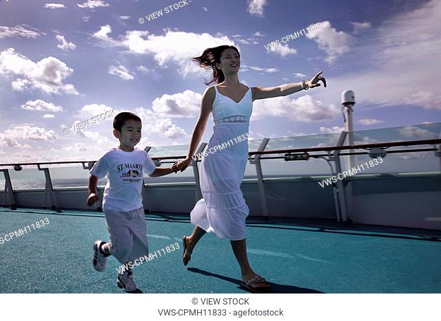 Mother And Son Running On The Board