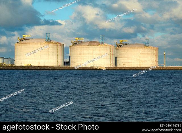 Big oil silos in a dock