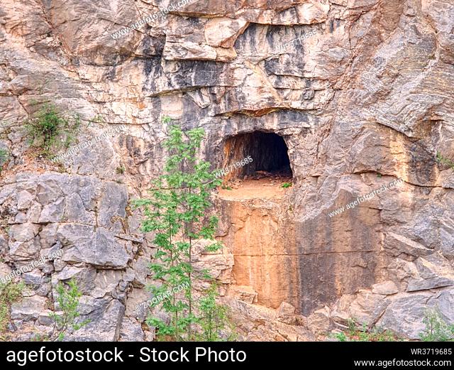 Abandoned and collapsed sandstone or limestone tunnel or adit in canyon mine