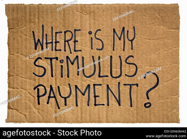Where is my stimulus payment? Handwriting on a piece of cardboard. Economic recession and relief bill during coronavirus covid-19 pandemic