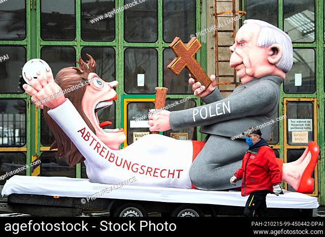 15 February 2021, North Rhine-Westphalia, Duesseldorf: A motto float on abortion rights in Poland is presented in front of the float building hall