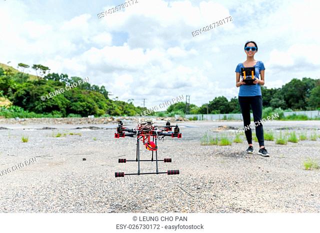 Woman controling a drone