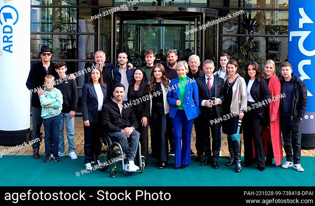 28 October 2023, Saxony, Leipzig: The cast of the hospital series ""In aller Freundschaft"" stands together for a group photo in front of their studios