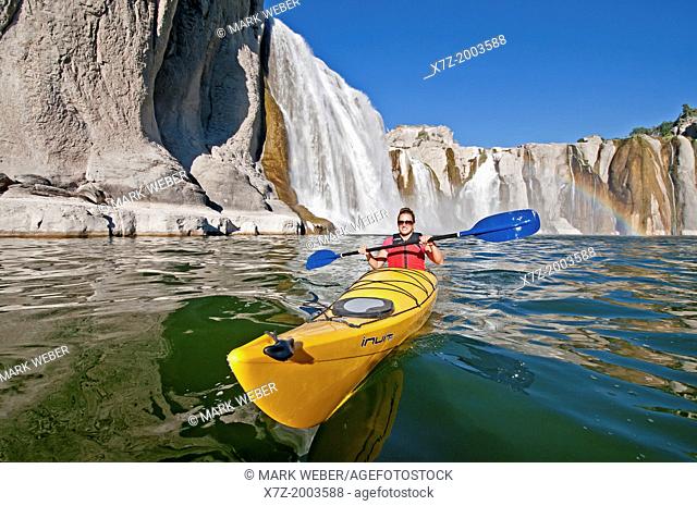 paddling a kayak below Shoshone Falls on the Snake River in the Snake River Canyon near the city of Twin Falls in southern Idaho