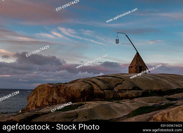 Old lighthouse at Verdens Ende, Vestfold, Norway. This lighthouse is made of rocks found at the beaches nearby