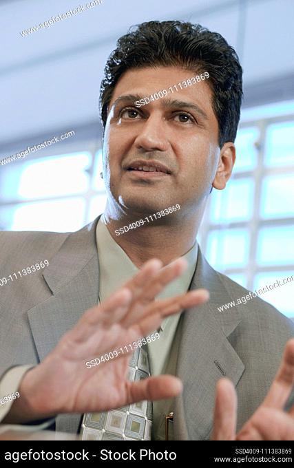 Indian businessman gesturing