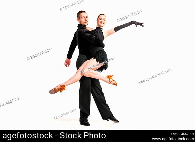 Beautiful two professional artists dancing over white background
