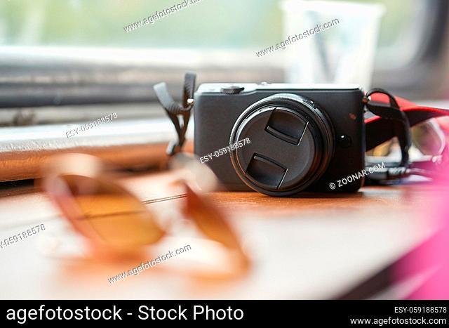 Small mirrorless travel camera on a table
