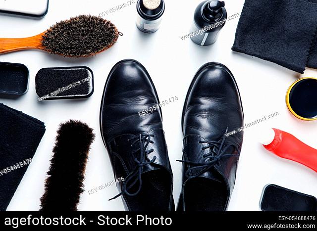 Cleaning boots concept on white background