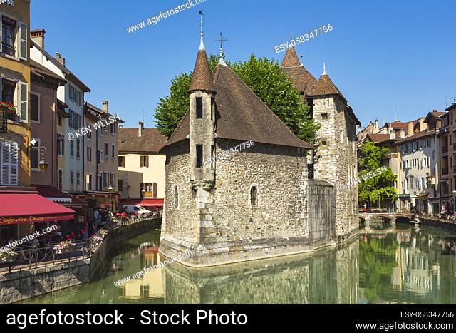 Annecy, Haute-Savoie department, Rhone-Alpes, France. The 12th century castle Palais de l'Isle in the middle of the Thiou river