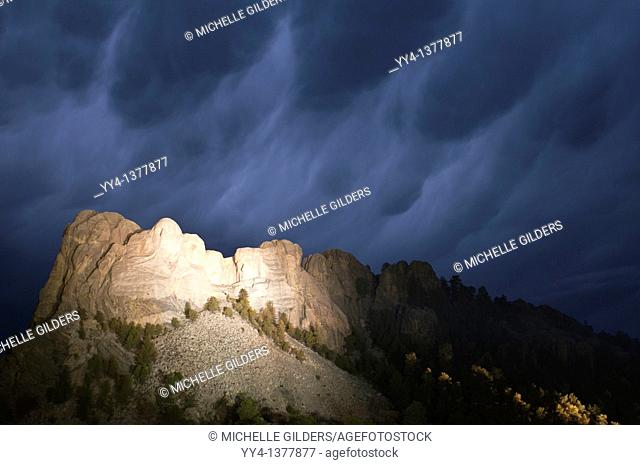 Storm clouds over Mount Rushmore National Memorial, at night, South Dakota, USA
