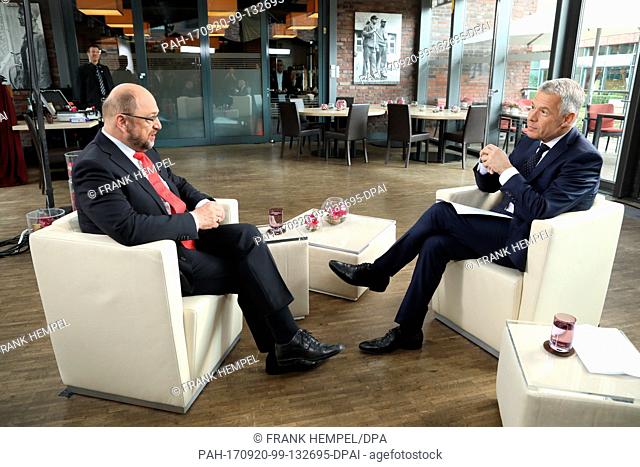 HANDOUT - The handout picture made available shows Germany's Social Democratic Party's (SPD) top candidate Martin Schulz (L) being interviewed by RTL head...