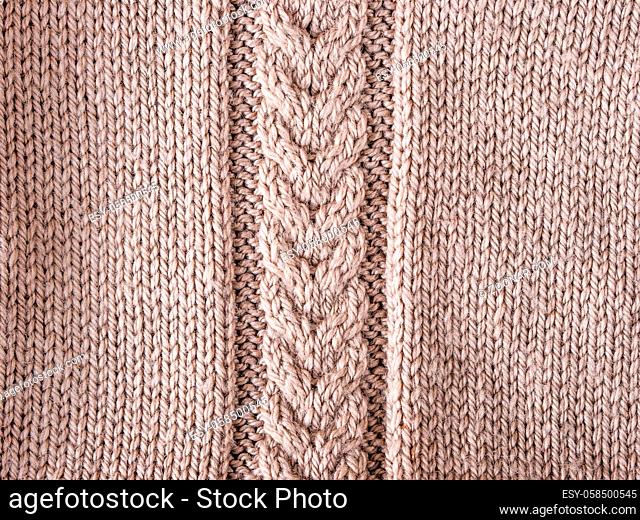 mocha knitted braid on knit cloth sweater as background